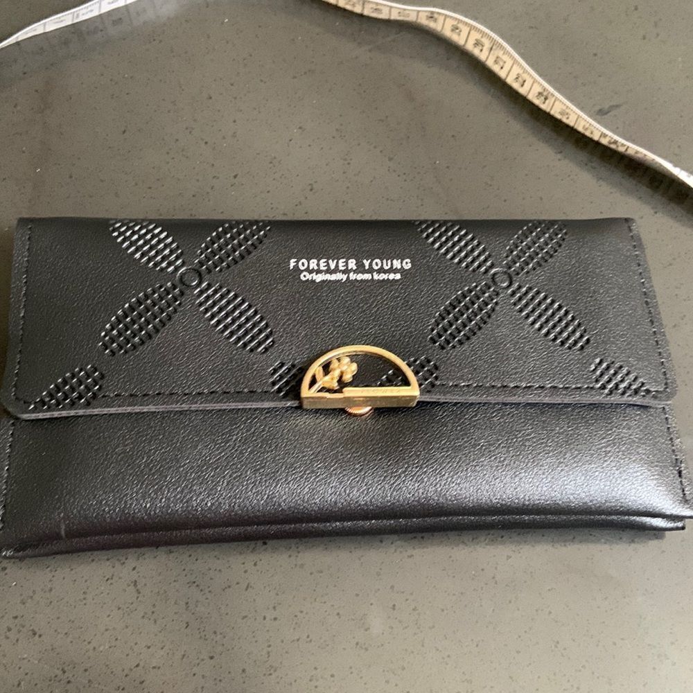 NIP  black wristlet forever young originally from Korea